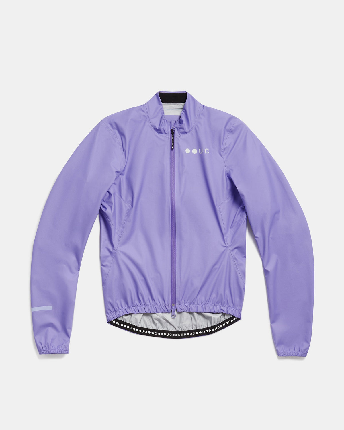 Flatlay of the Women's Mono Rain Jacket in Cloud Lilac: high collar, full-length zip, UC chest logo, elasticated hem.