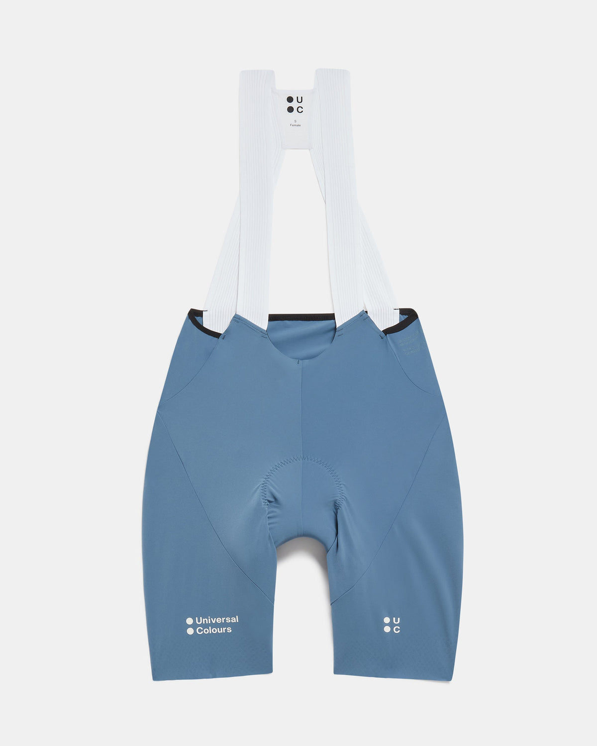 Flatlay of the Women's Chroma Bib Shorts in Slate Blue: ribbed bib straps, Universal Colours hip print and leg logos.