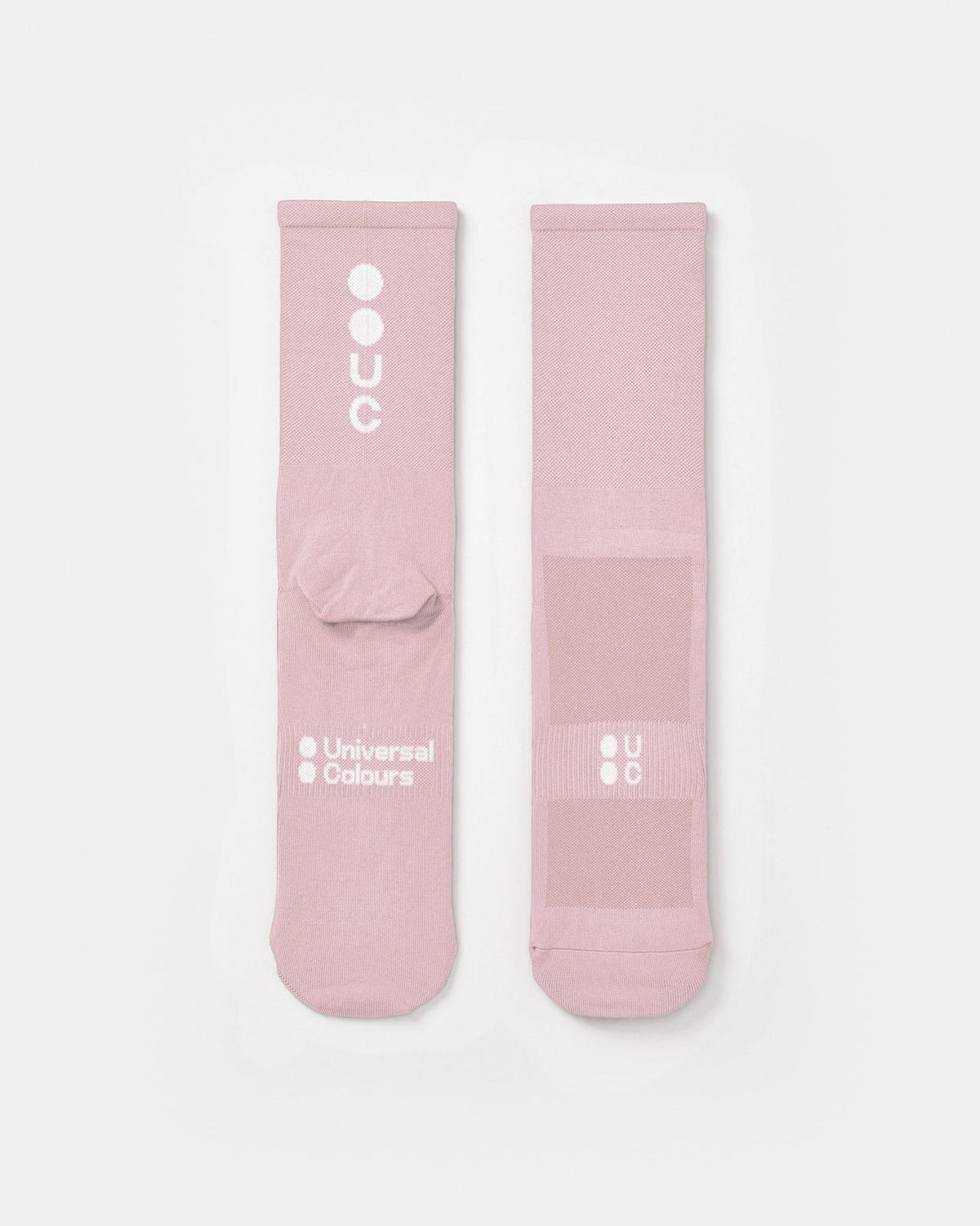 Flatlay of the Mono Summer Socks in Washed Pink: vertical UC logo on the cuff, horizontal UC mark on the foot.