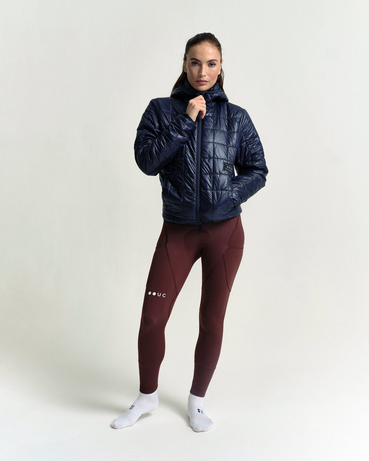 Model in the Unisex Insulated Packable Jacket in Ink Blue, full-length view.