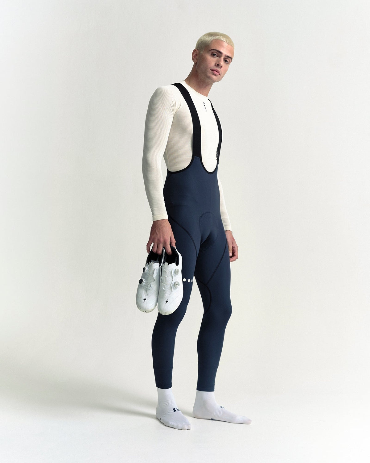 Model wearing the Men's Mono Bib Tight in Eclipse Navy.