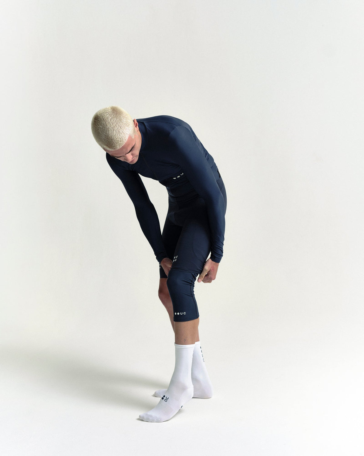 Model in the Knee Warmers in Eclipse Navy, full-length view.
