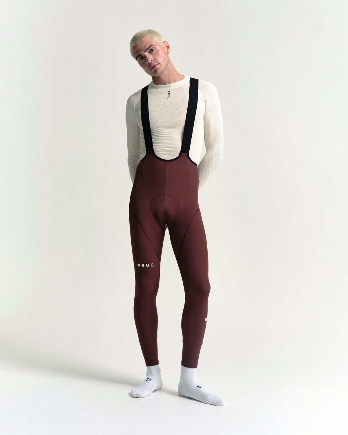 Model wearing the Men's Mono Bib Tight in Deep Red.