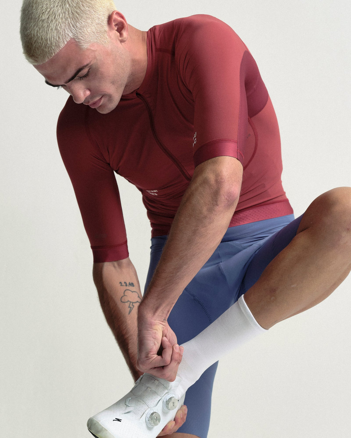 Model wearing the Men's Chroma Short Sleeve Jersey in Earth Red.
