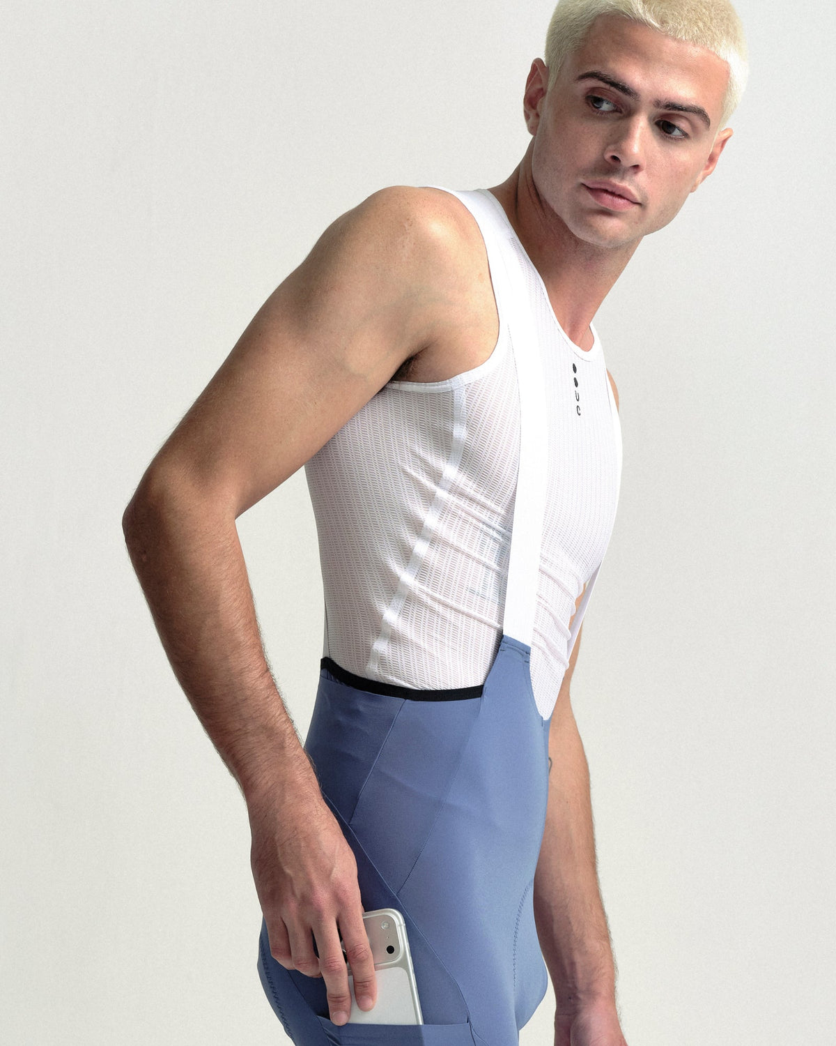 Model wearing the Men's Chroma Cargo Bib Shorts in Slate Blue.