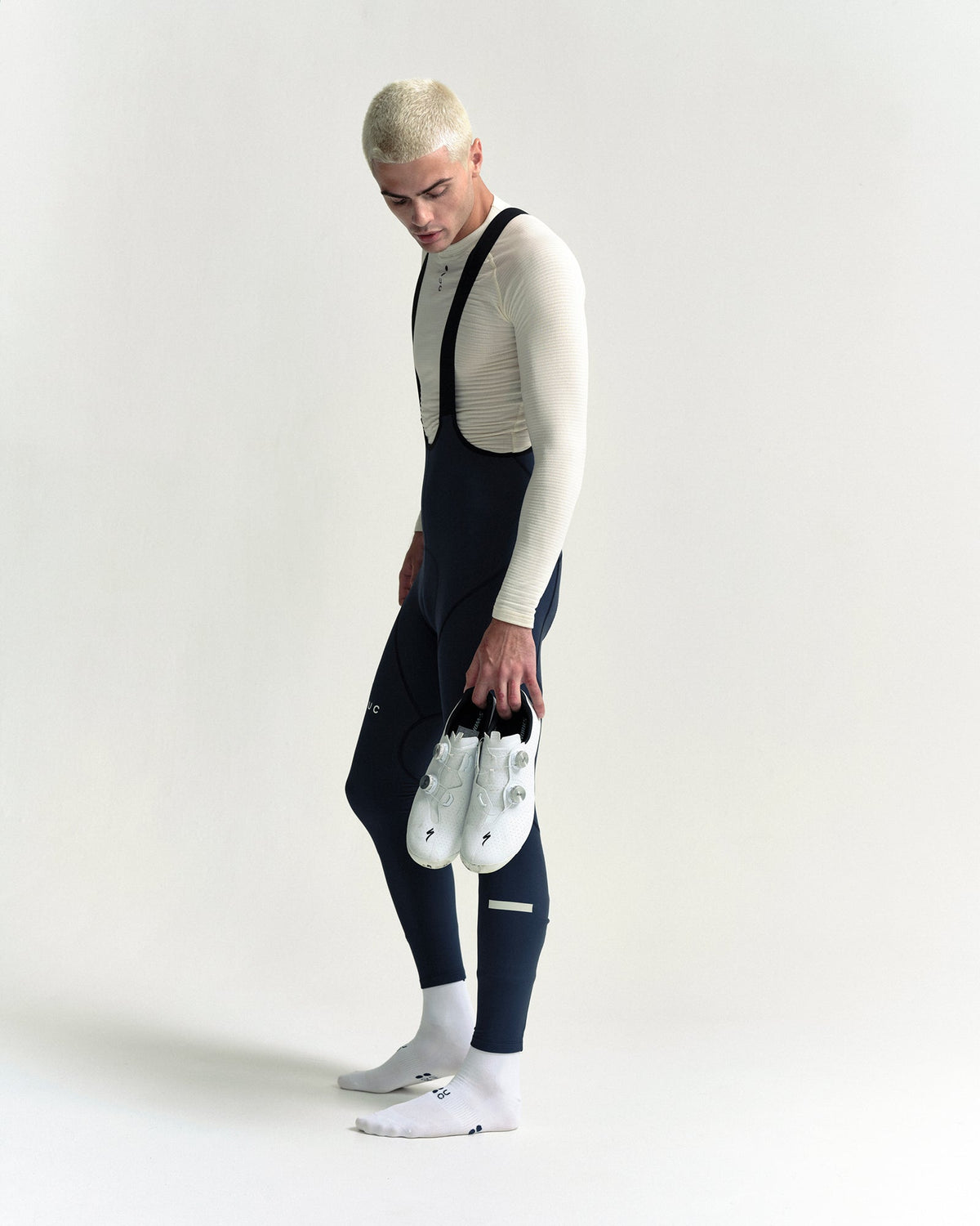 Model wearing the Men's Mono Bib Tight in Eclipse Navy.