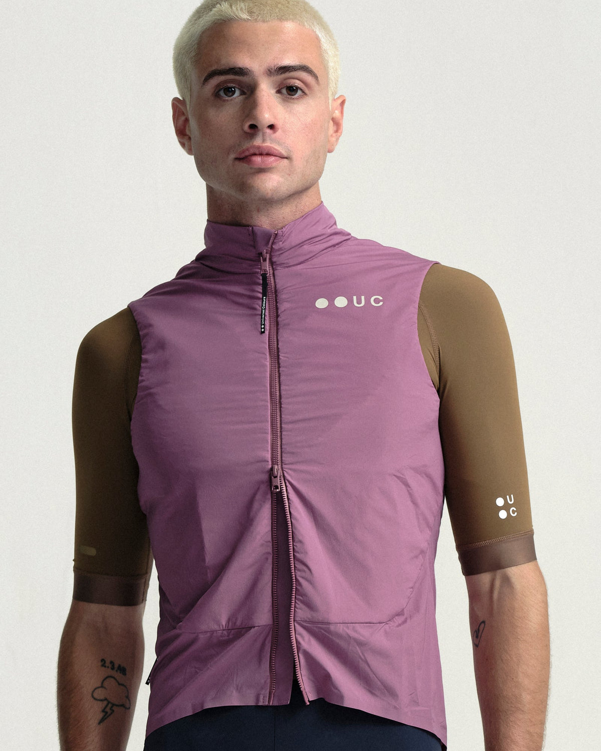 Model wearing the Men's Chroma Insulated Gilet in Dusty Rose.