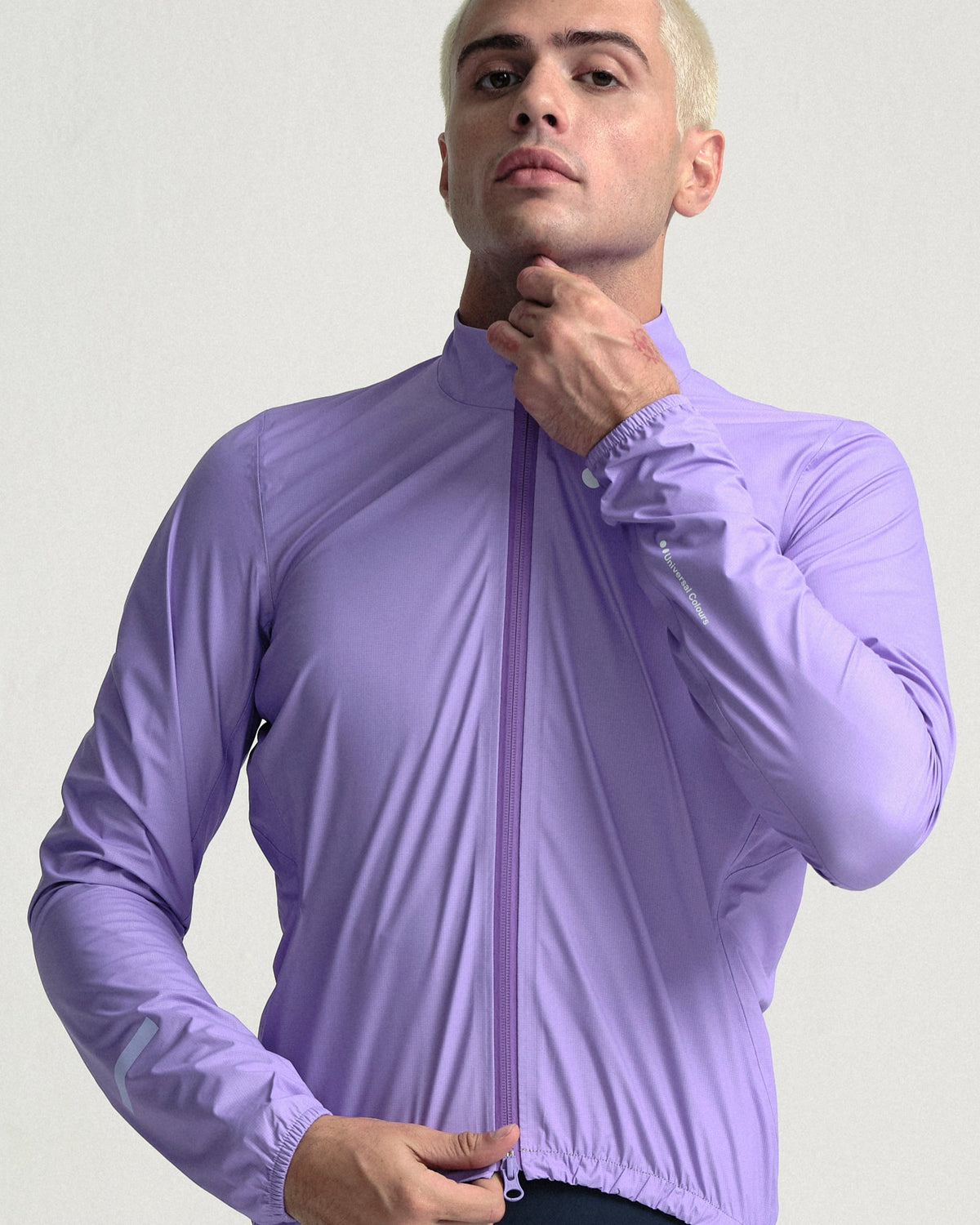 Model wearing the Men's Mono Rain Jacket in Cloud Lilac.