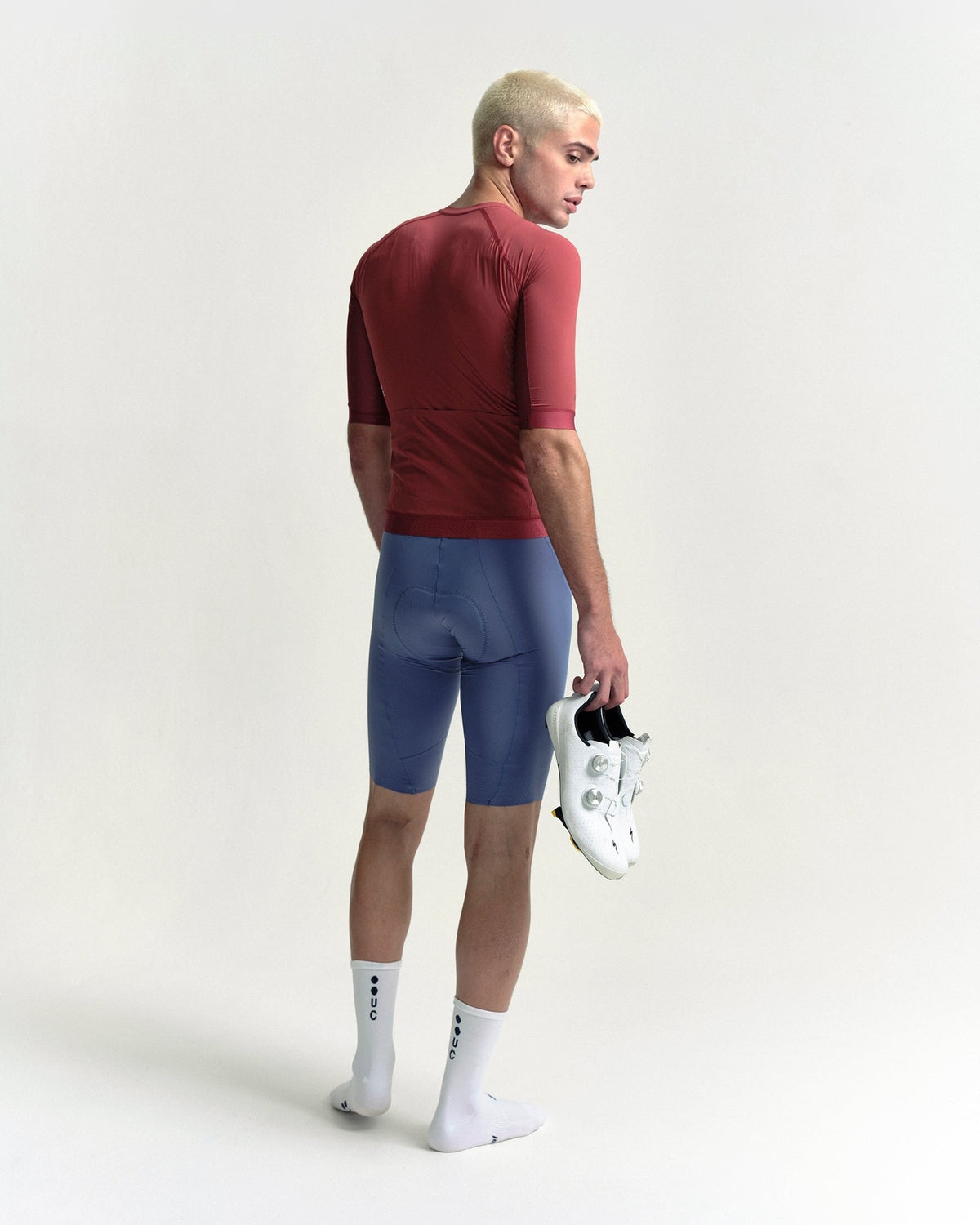 Model wearing the Men's Chroma Short Sleeve Jersey in Earth Red.