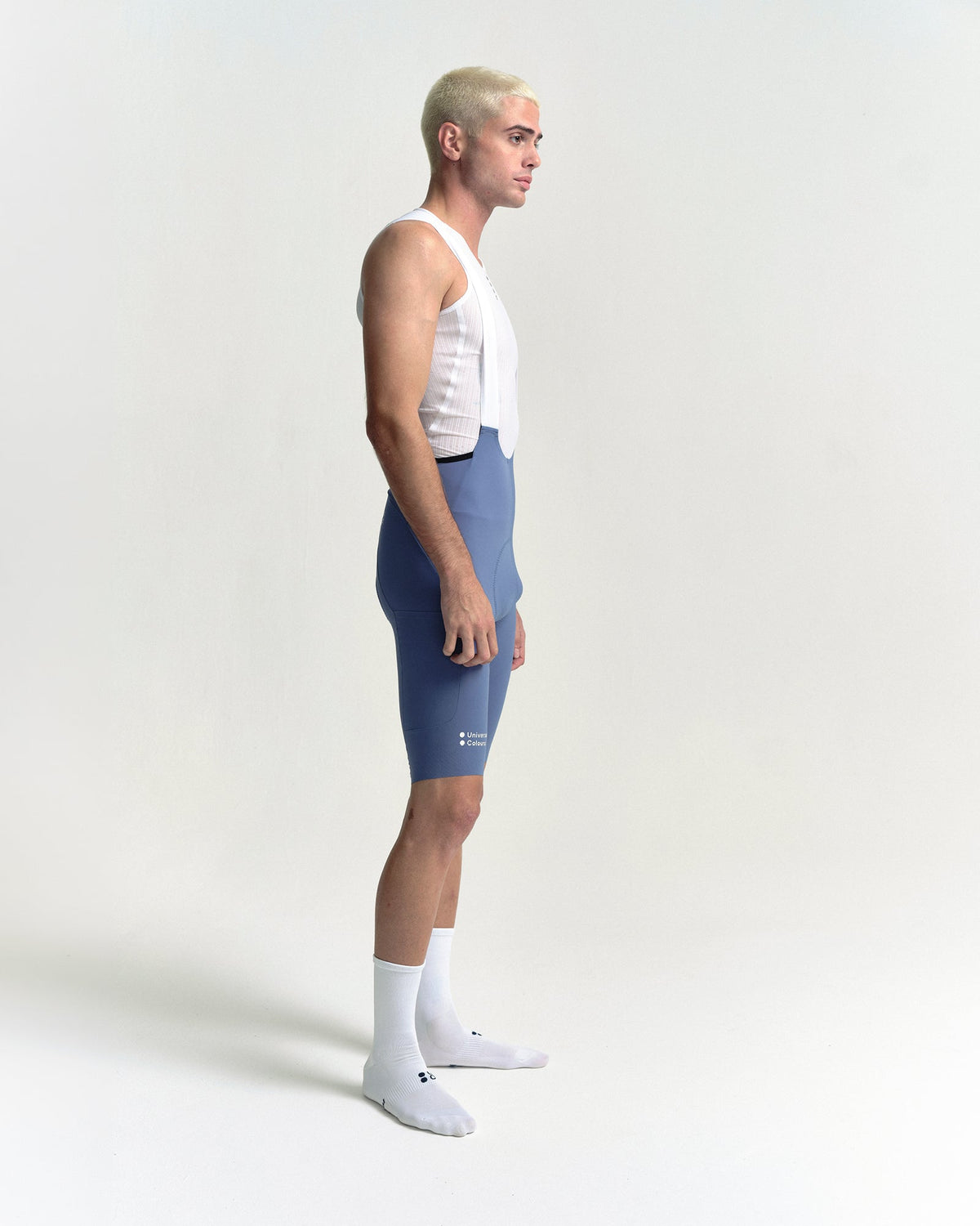 Model wearing the Men's Chroma Cargo Bib Shorts in Slate Blue.