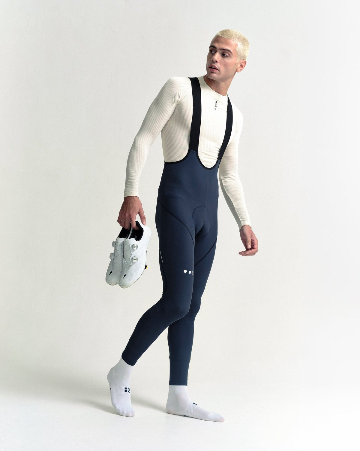Model in the Men's Mono Bib Tight in Eclipse Navy, full-length view.