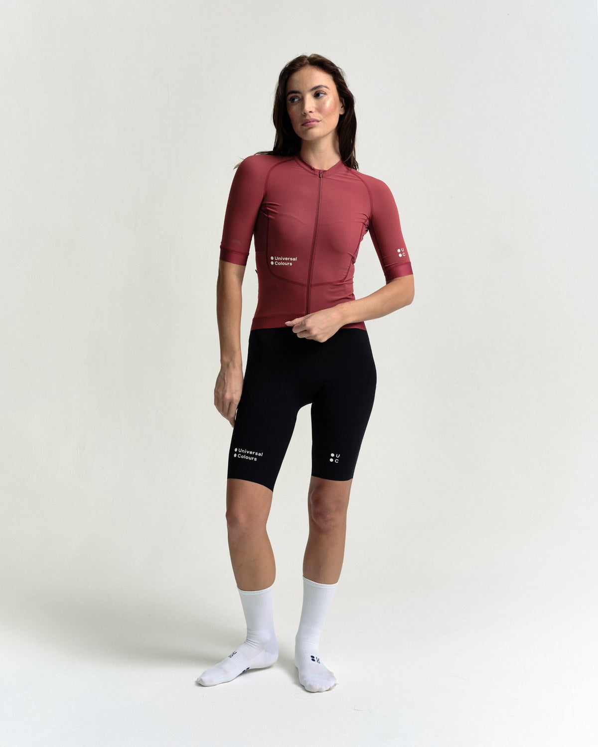 Model wearing the Women's Chroma Short Sleeve Jersey in Earth Red.