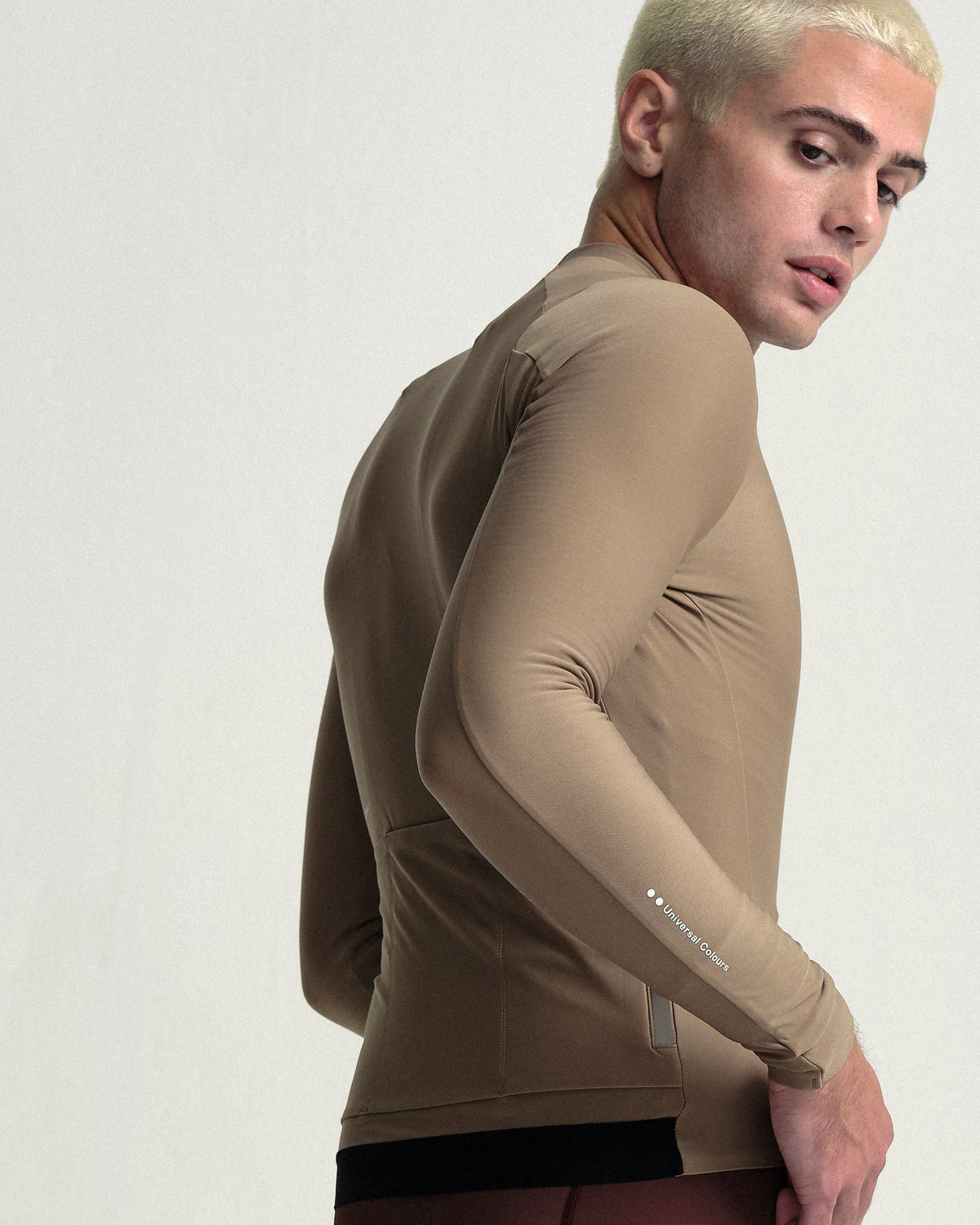 Model wearing the Men's Mono Long Sleeve Jersey in Walnut Brown.