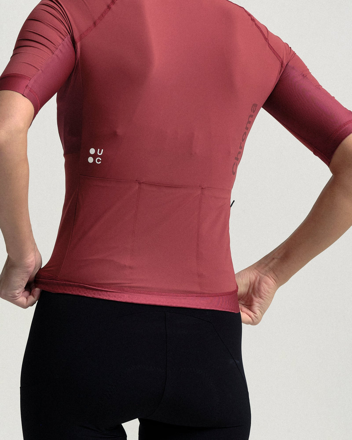 Model wearing the Women's Chroma Short Sleeve Jersey in Earth Red.
