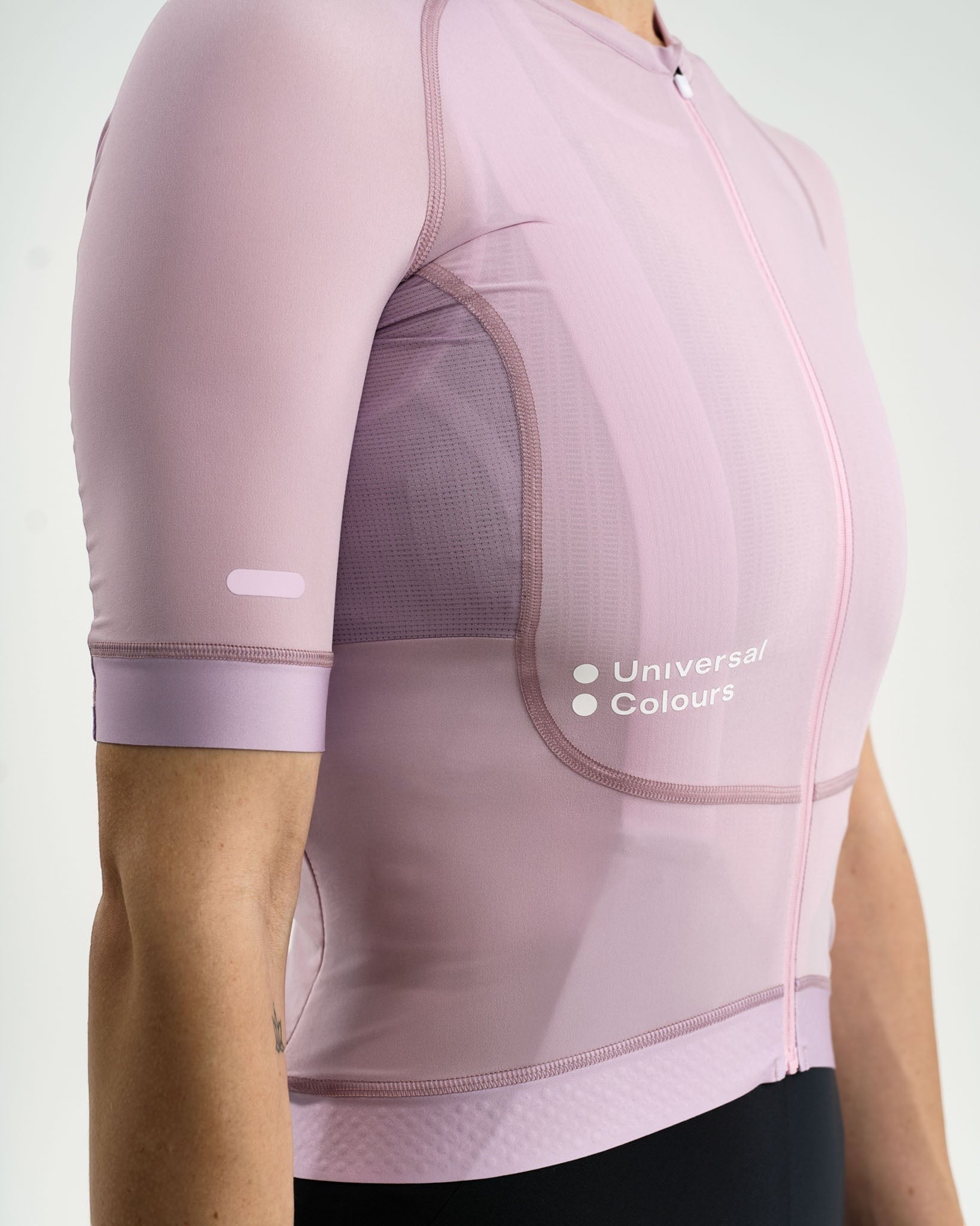 Moloko Cycling Ltd. women's washed lilac short sleeve cycling jersey made from recycled polyester and Italian woven fabric with a tailored fit and three rear pockets.