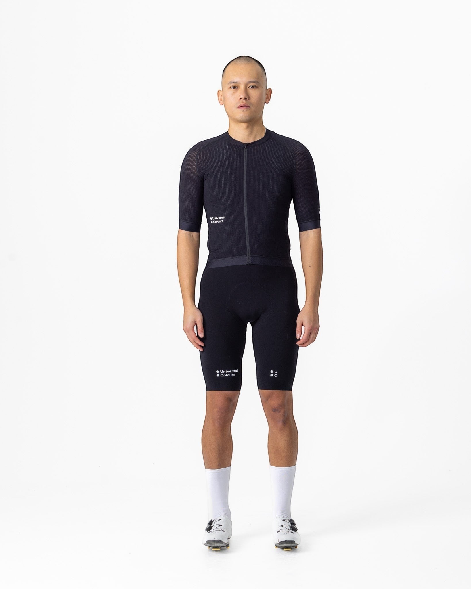 Moloko Cycling Ltd. men's black short sleeve cycling jersey made from French nylon with a cropped fit and raglan sleeves.