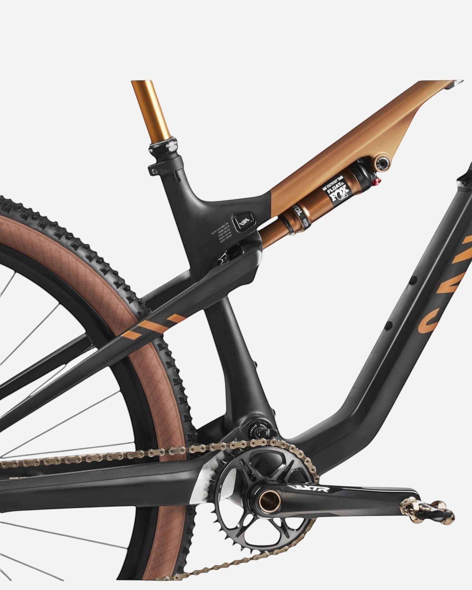 Moloko Cycling Ltd. Ex-Demo Lux Trail CFR 2024 M full suspension mountain bike frame with Fox Float shock, black and bronze.