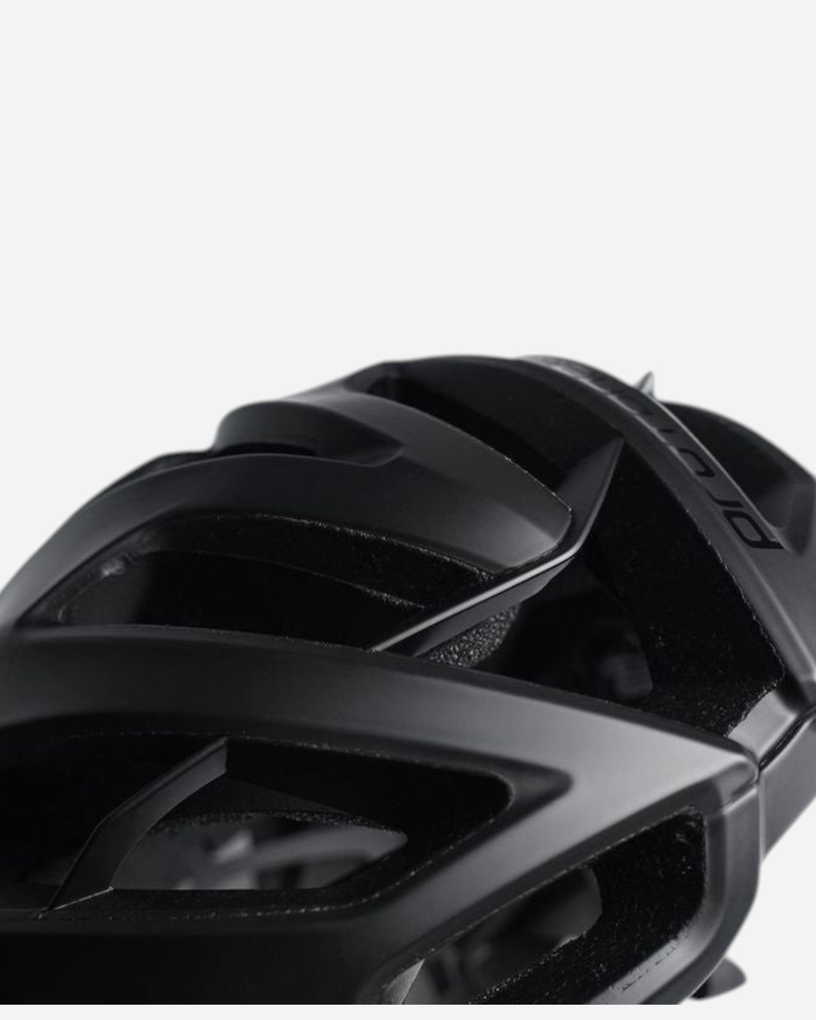 Moloko Cycling Ltd. Matt black Kask Protone Icon road cycling helmet with ventilation channels and adjustable fit system.