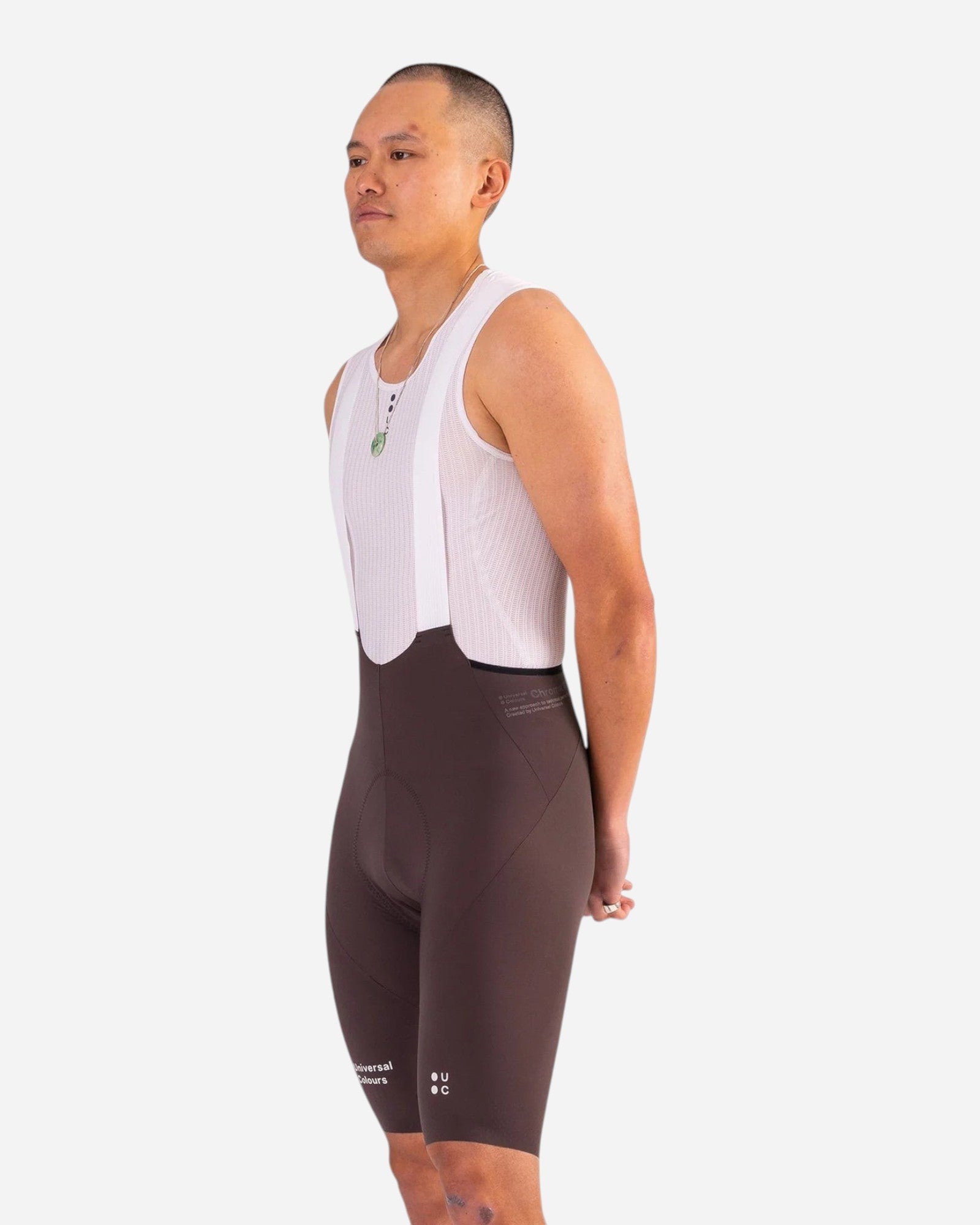 Moloko Cycling Ltd. Men's heavy dark brown nylon bib shorts with white mesh straps and a chamois pad.