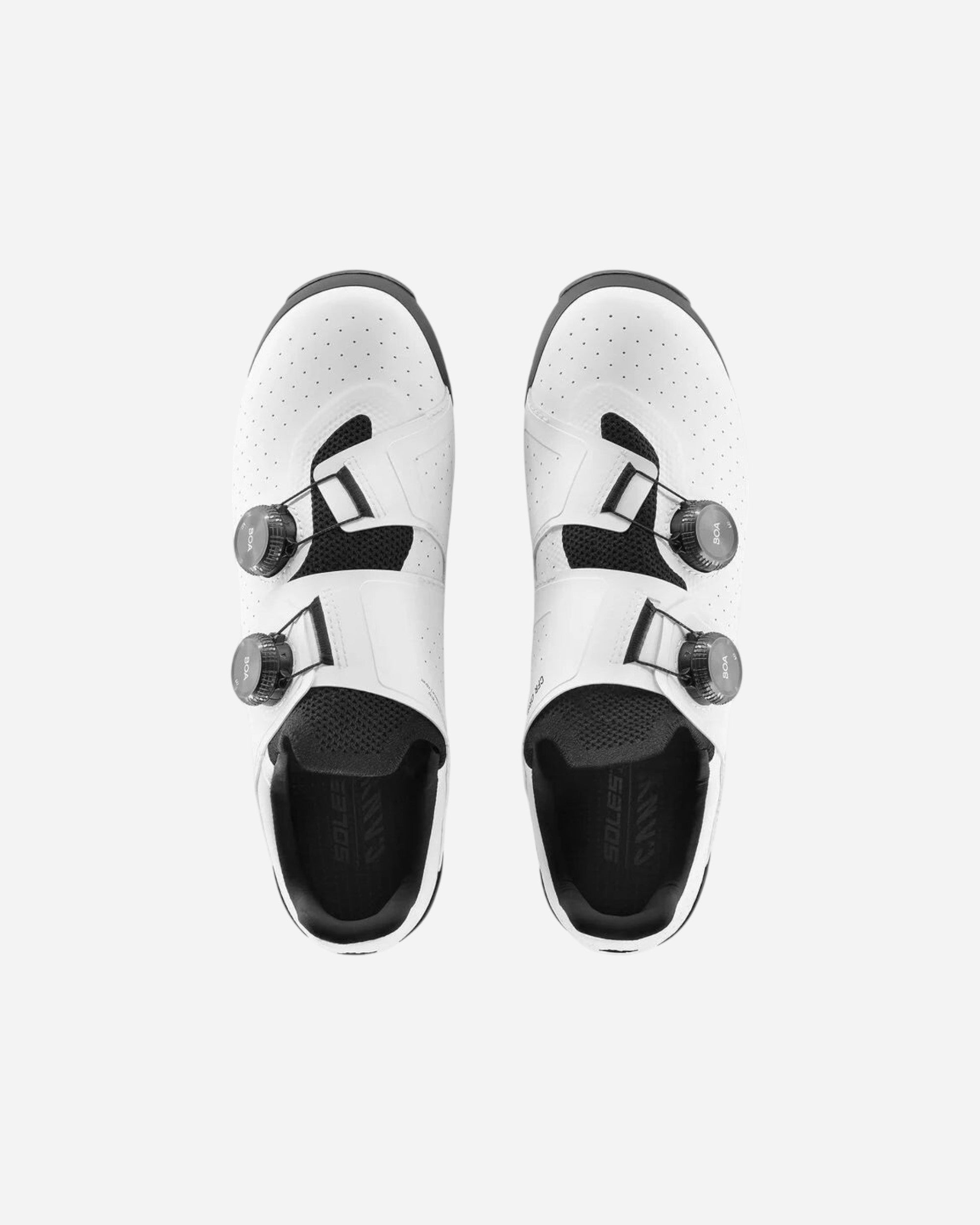 Moloko Cycling Ltd. white off-road cycling shoes with black BOA dials and Vibram soles.