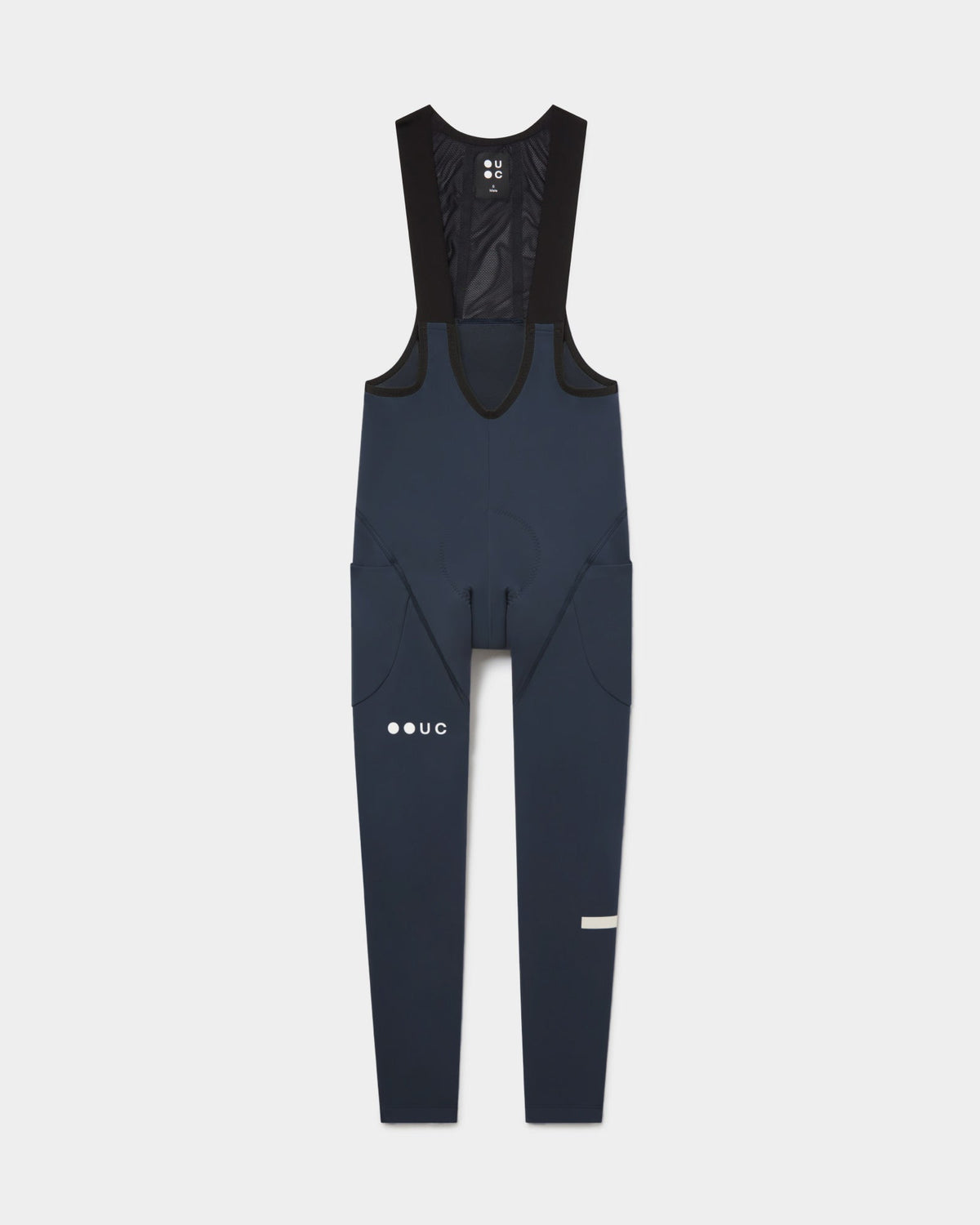 Flatlay of the Men's Mono Cargo Bib Tight in Eclipse Navy: mesh upper bib, side thigh cargo pockets and UC leg logo.