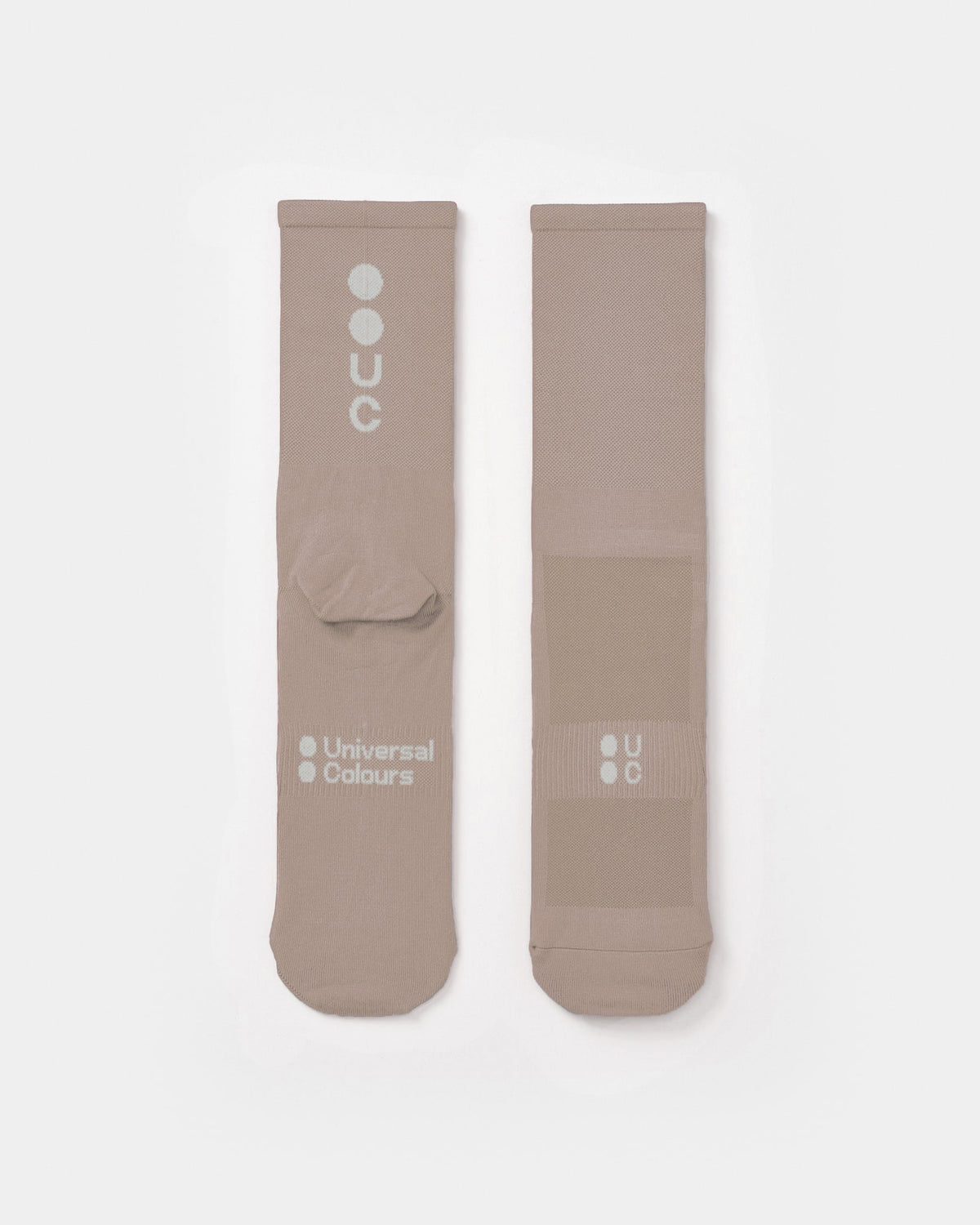 Flatlay of the Mono Summer Socks in Moon Rock: vertical UC logo on the cuff, horizontal UC mark on the foot.