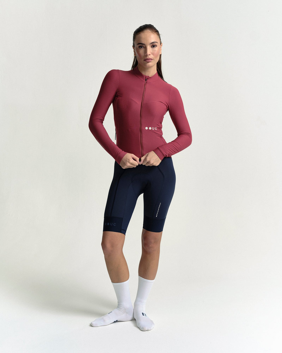 Model wearing the Women's Mono Long Sleeve Jersey in Apple Red.