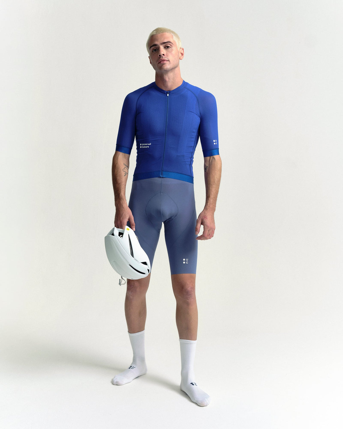 Model in the Men's Chroma Light Short Sleeve Jersey in Vivid Blue, full-length view.