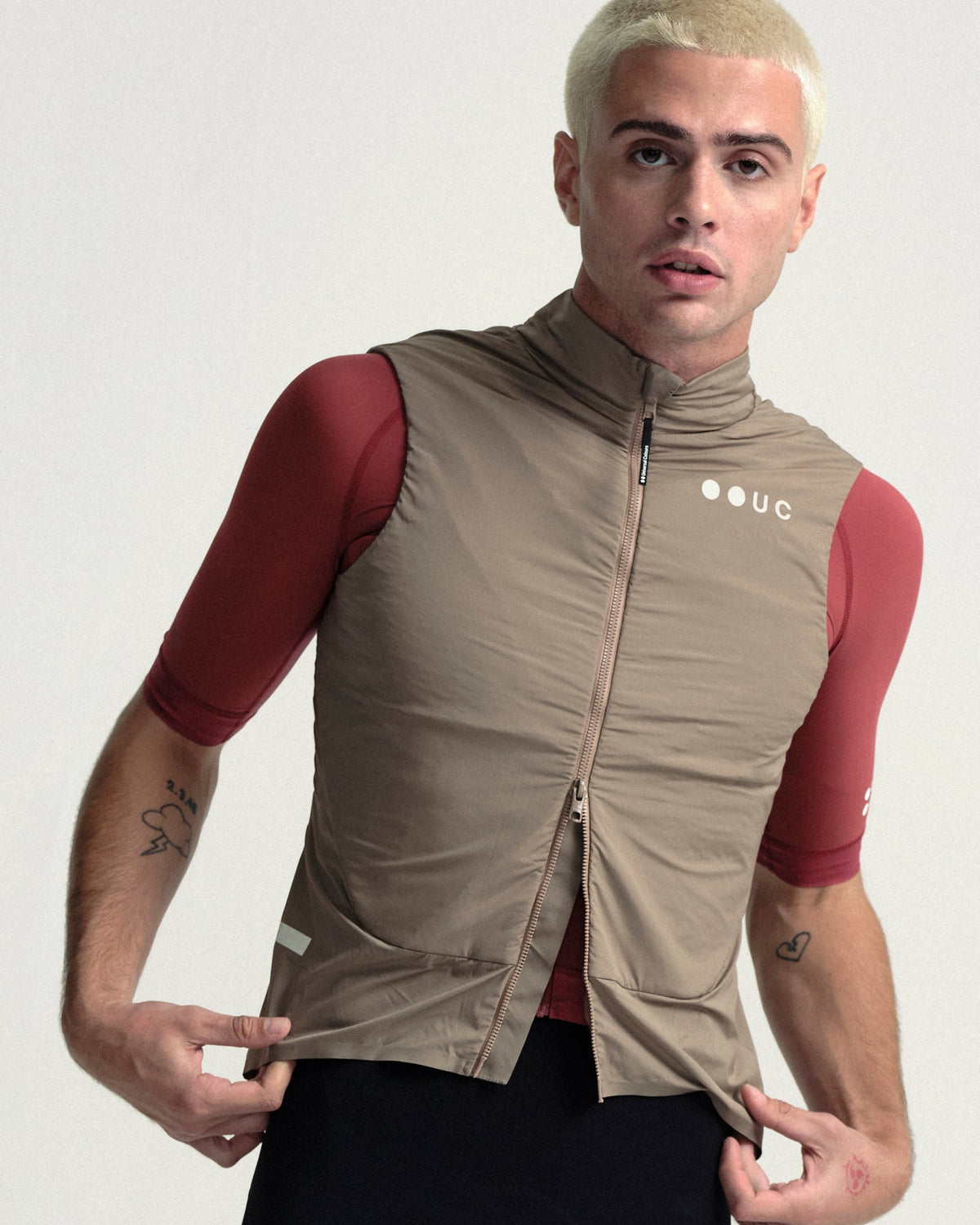 Model wearing the Men's Chroma Insulated Gilet in Walnut Brown.