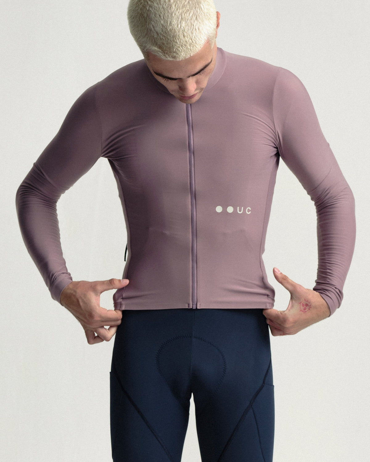 Model wearing the Men's Mono Long Sleeve Jersey in Mauve Mist.