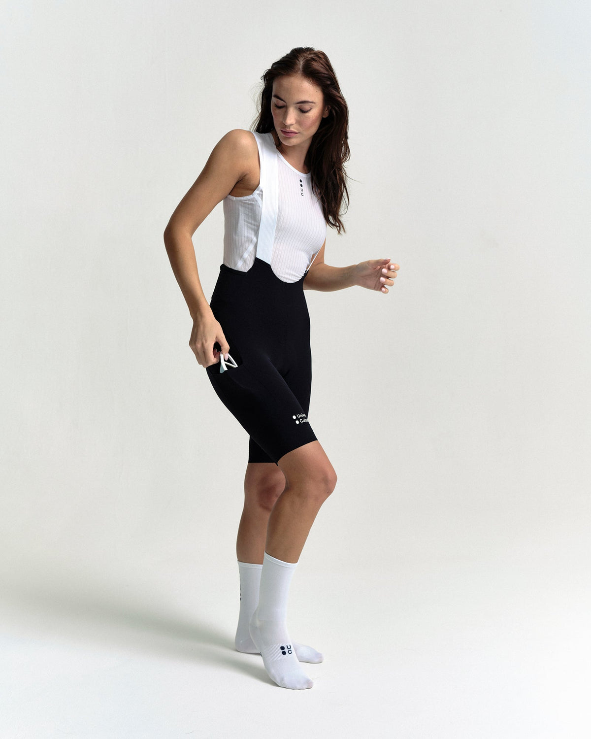 Model wearing the Women's Chroma Cargo Bib Shorts in Black.