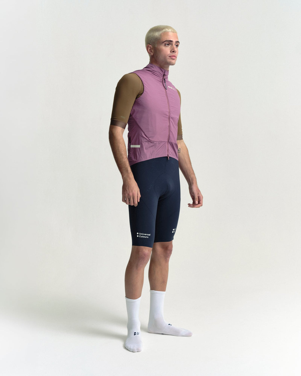 Model wearing the Men's Chroma Insulated Gilet in Dusty Rose.