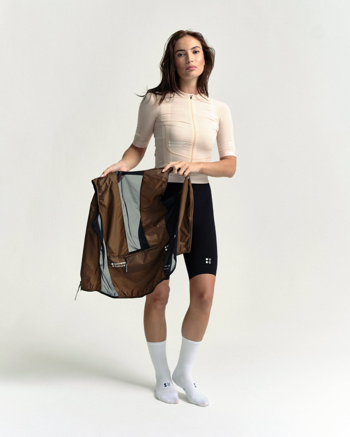 Model wearing the Women's Spectrum Gilet 2.0 in Honey Gold.
