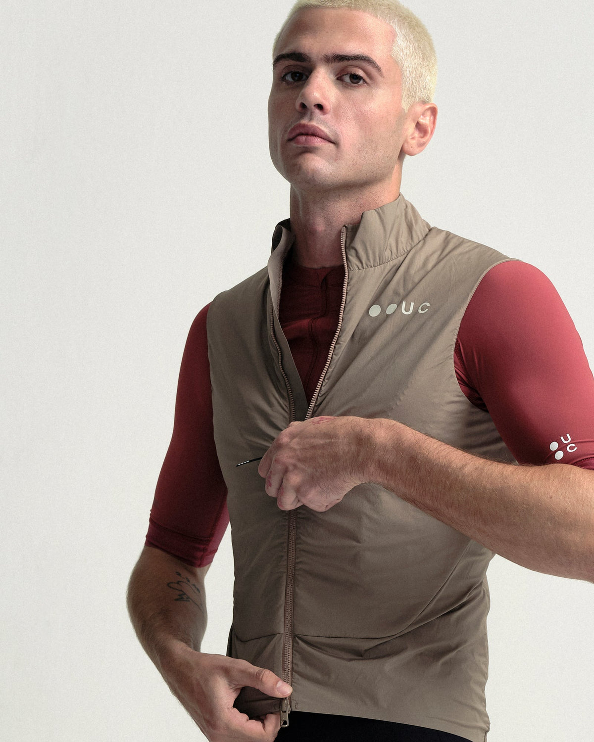 Model wearing the Men's Chroma Insulated Gilet in Walnut Brown.