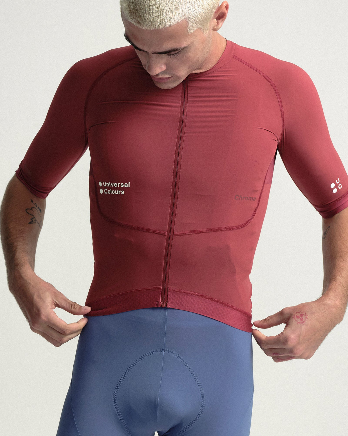 Model wearing the Men's Chroma Short Sleeve Jersey in Earth Red.