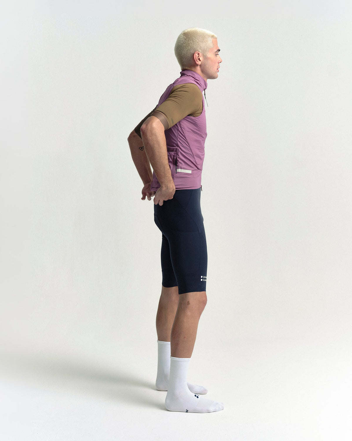 Model wearing the Men's Chroma Insulated Gilet in Dusty Rose.