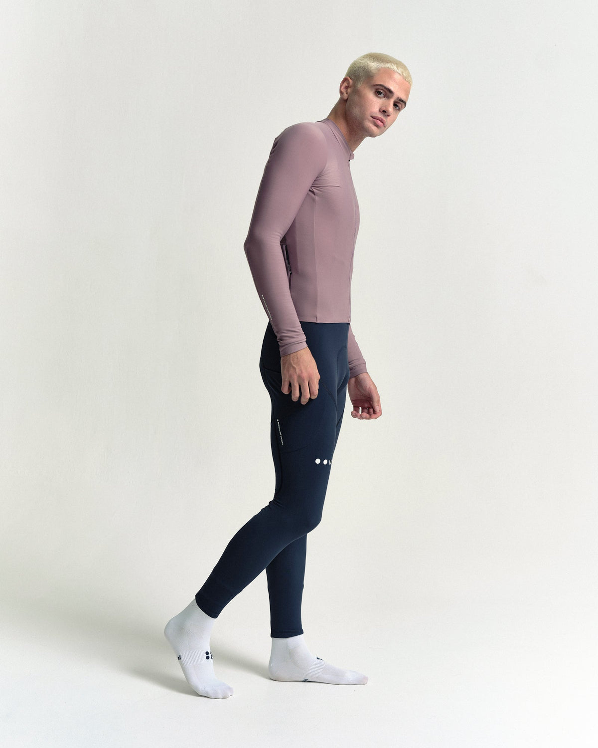 Model in the Men's Mono Long Sleeve Jersey in Mauve Mist, full-length view.