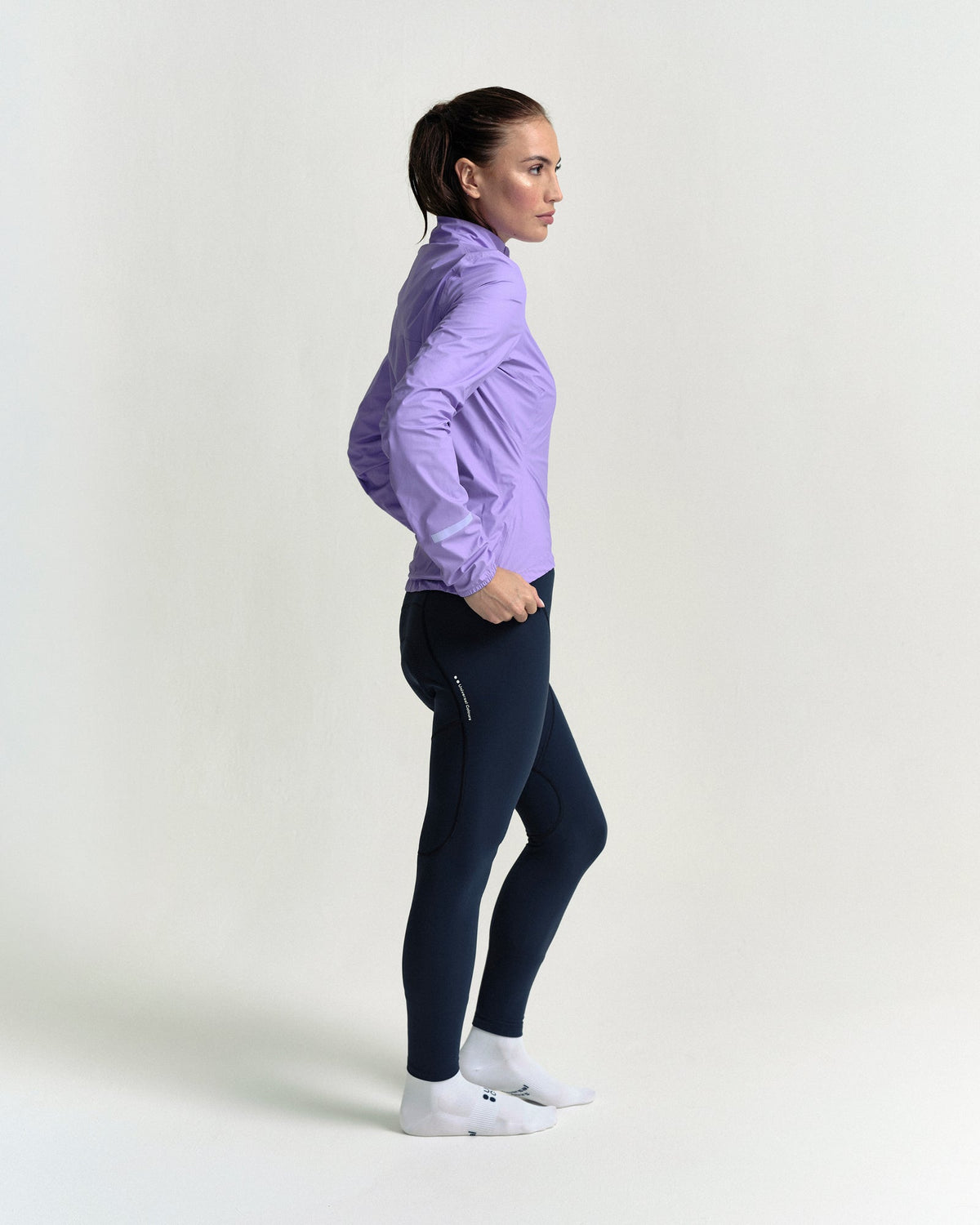 Model in the Women's Mono Rain Jacket in Cloud Lilac, side view.