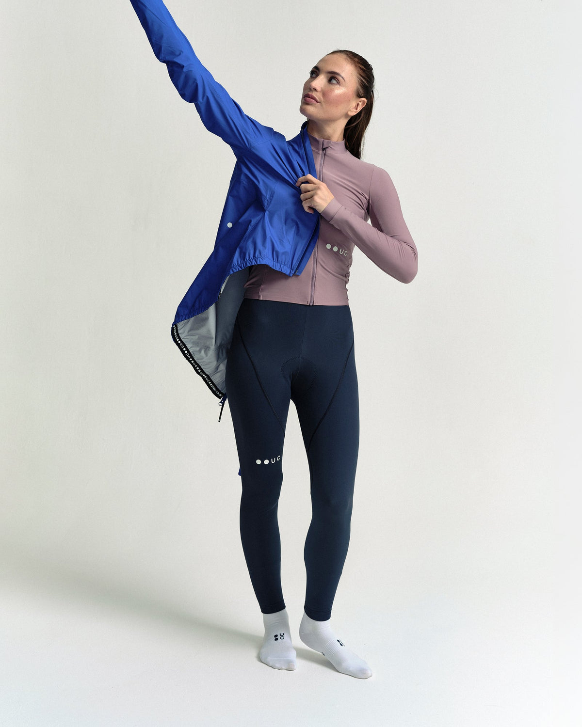 Model wearing the Women's Mono Rain Jacket in Vivid Blue.