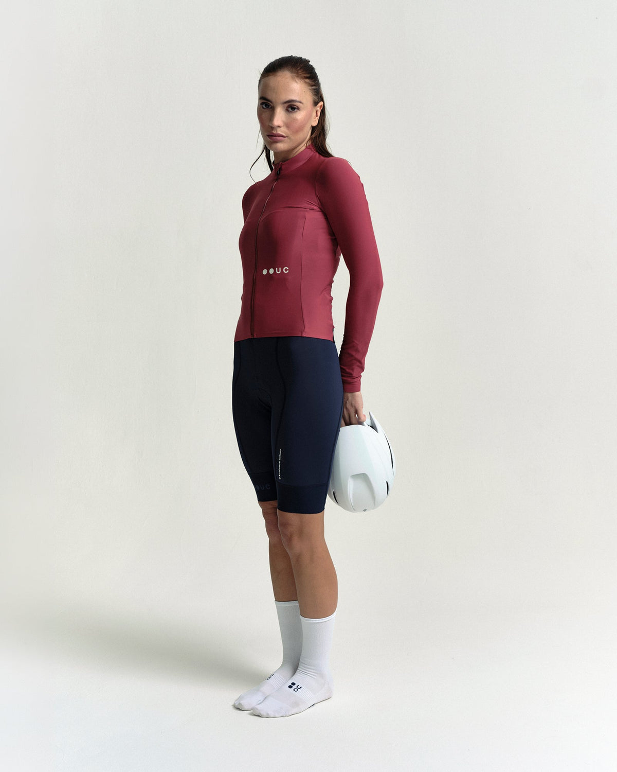 Model wearing the Women's Mono Long Sleeve Jersey in Apple Red.