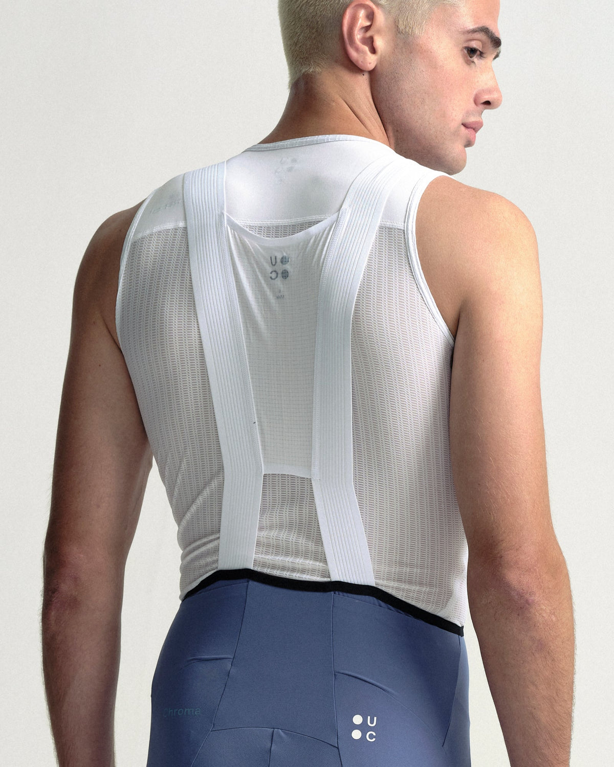 Model wearing the Men's Chroma Cargo Bib Shorts in Slate Blue.