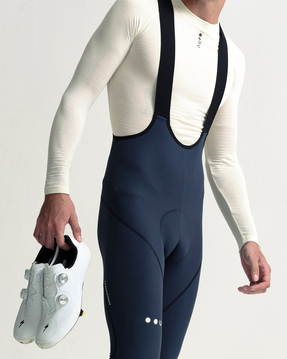 Model wearing the Men's Mono Bib Tight in Eclipse Navy.