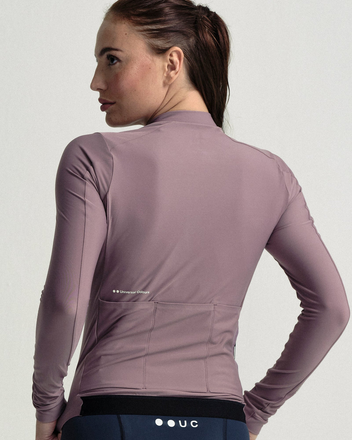 Model wearing the Women's Mono Long Sleeve Jersey in Mauve Mist.