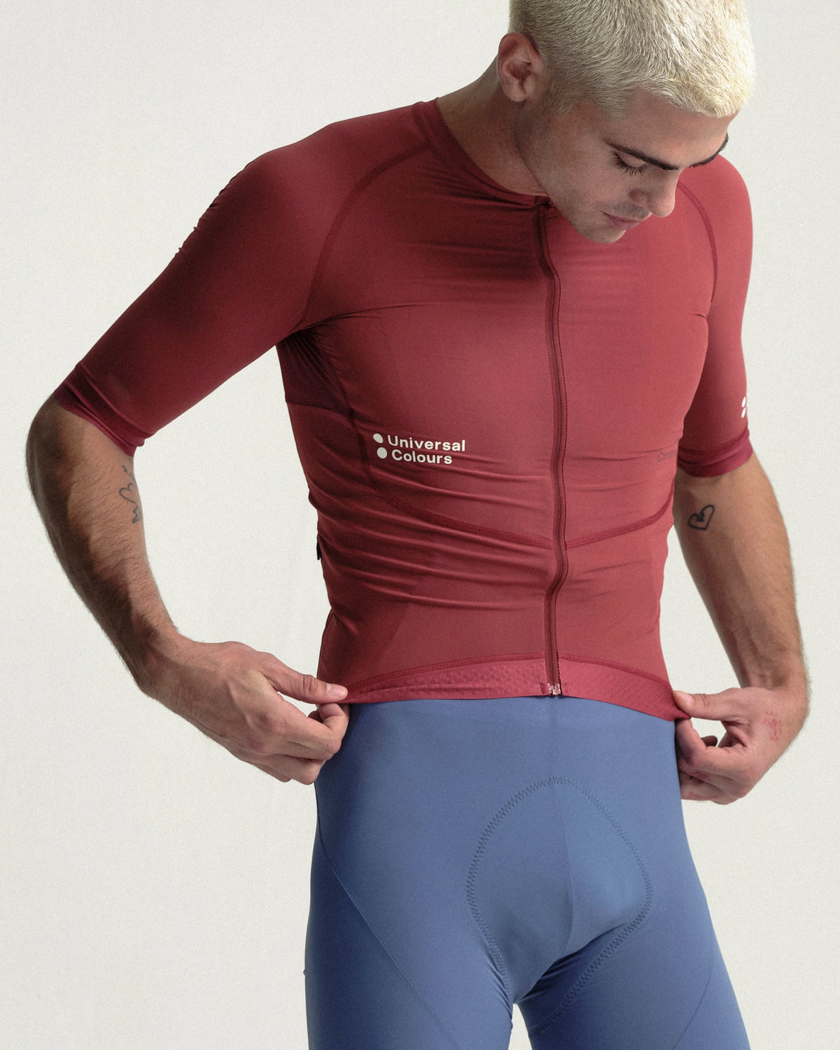 Model wearing the Men's Chroma Short Sleeve Jersey in Earth Red.