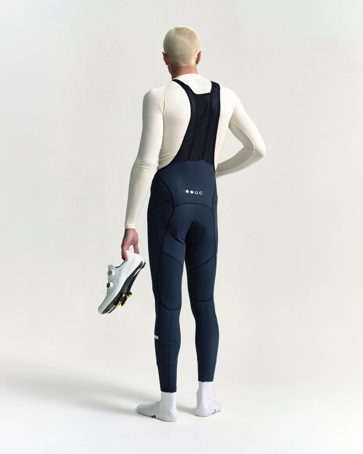Model wearing the Men's Mono Bib Tight in Eclipse Navy.