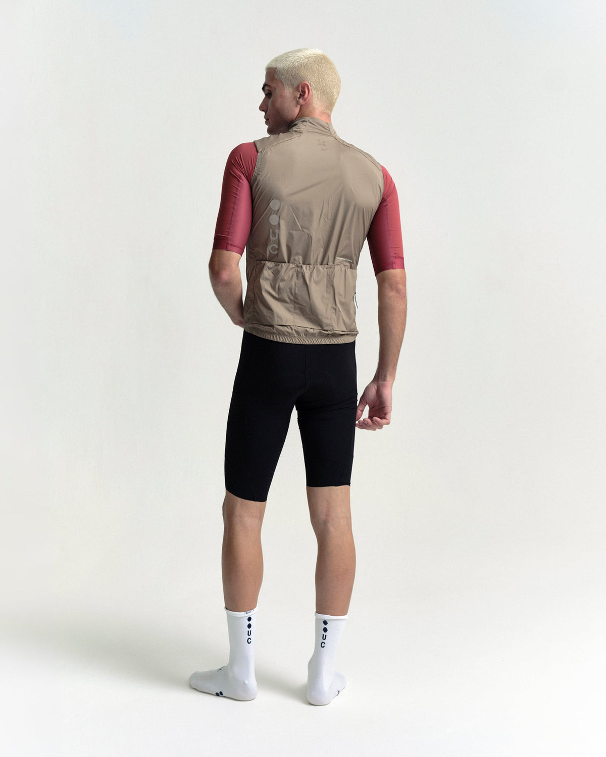 Model wearing the Men's Chroma Insulated Gilet in Walnut Brown.