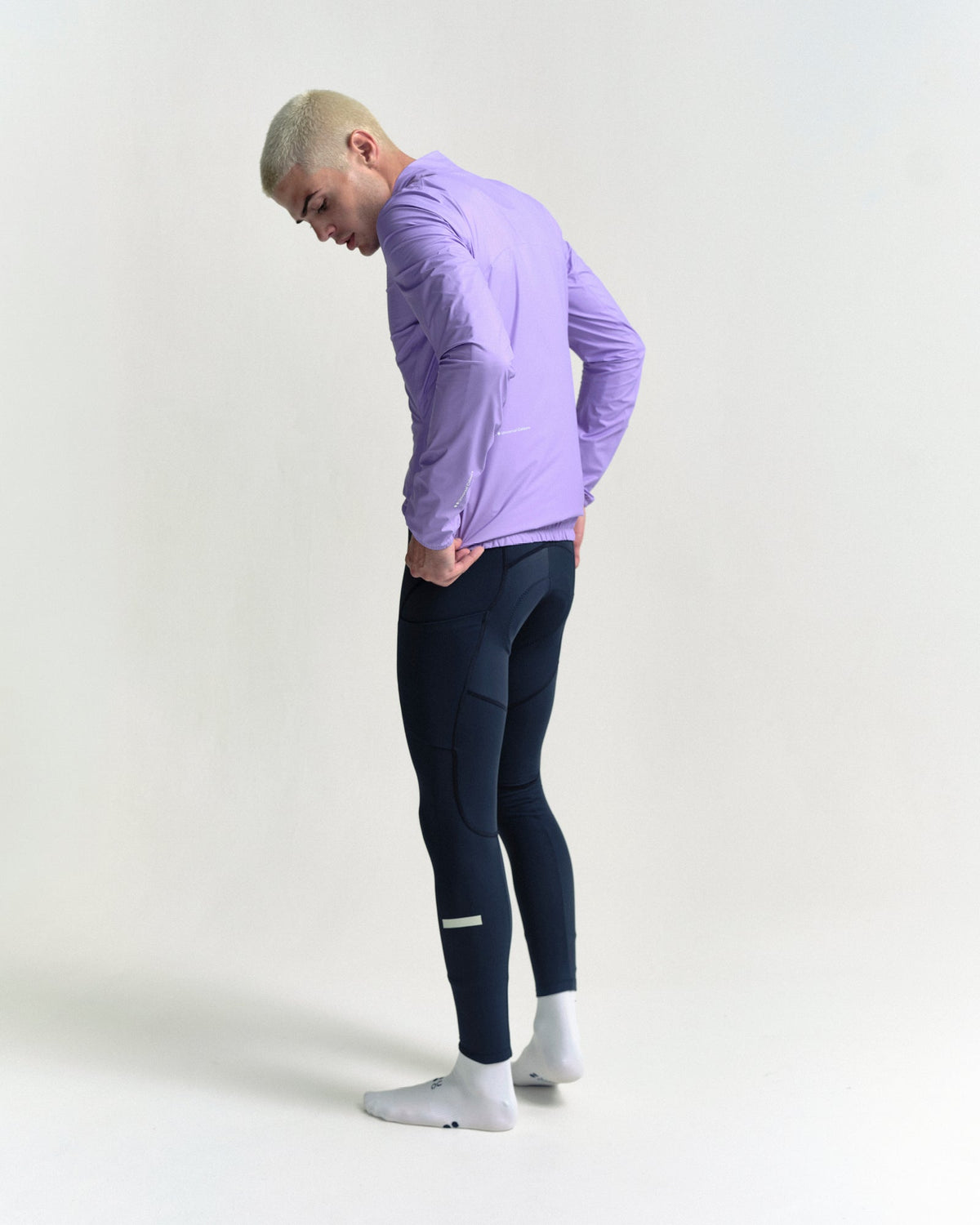 Model wearing the Men's Mono Rain Jacket in Cloud Lilac.