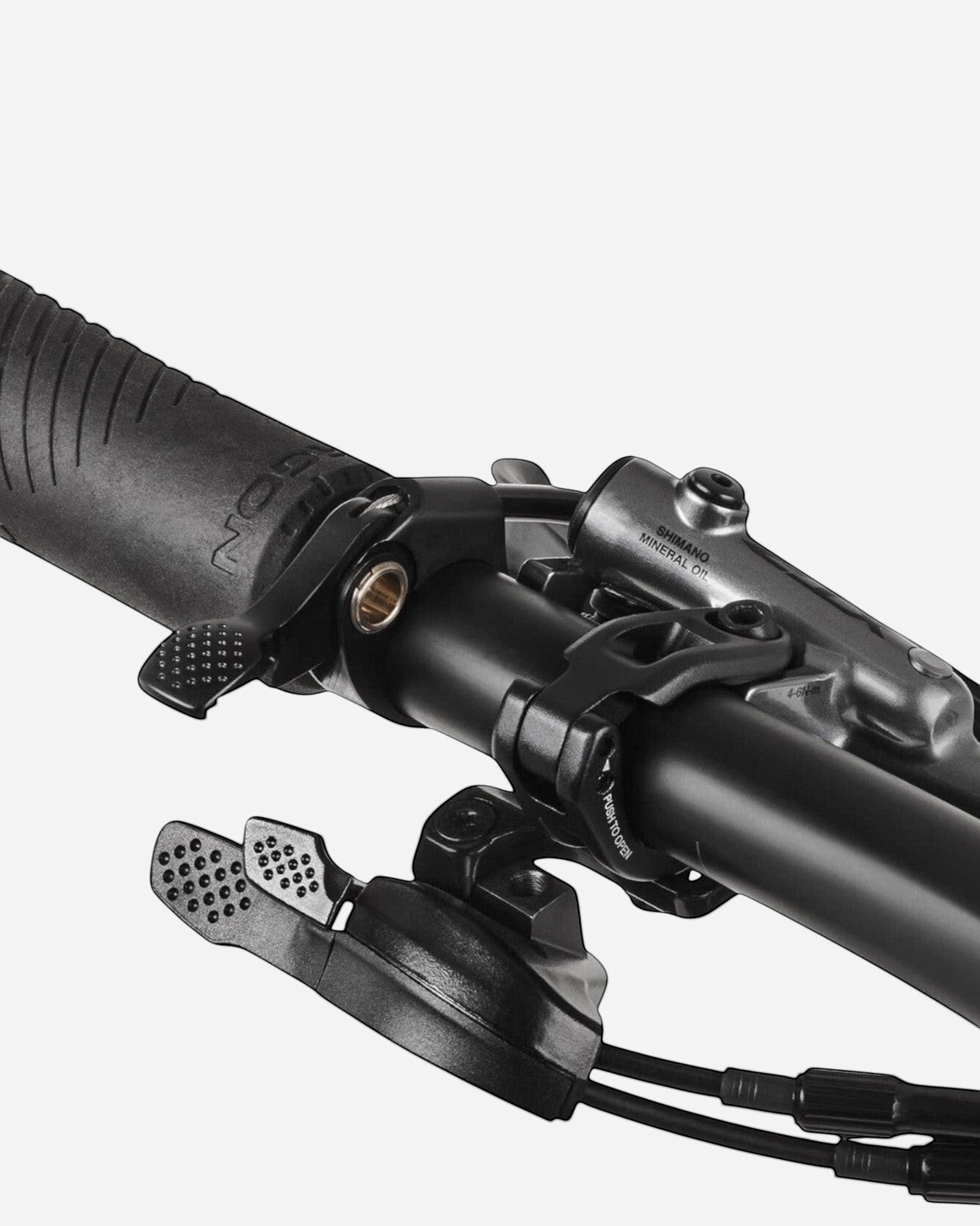 Moloko Cycling Ltd. black mountain bike handlebar with grip, shifter, and brake lever.