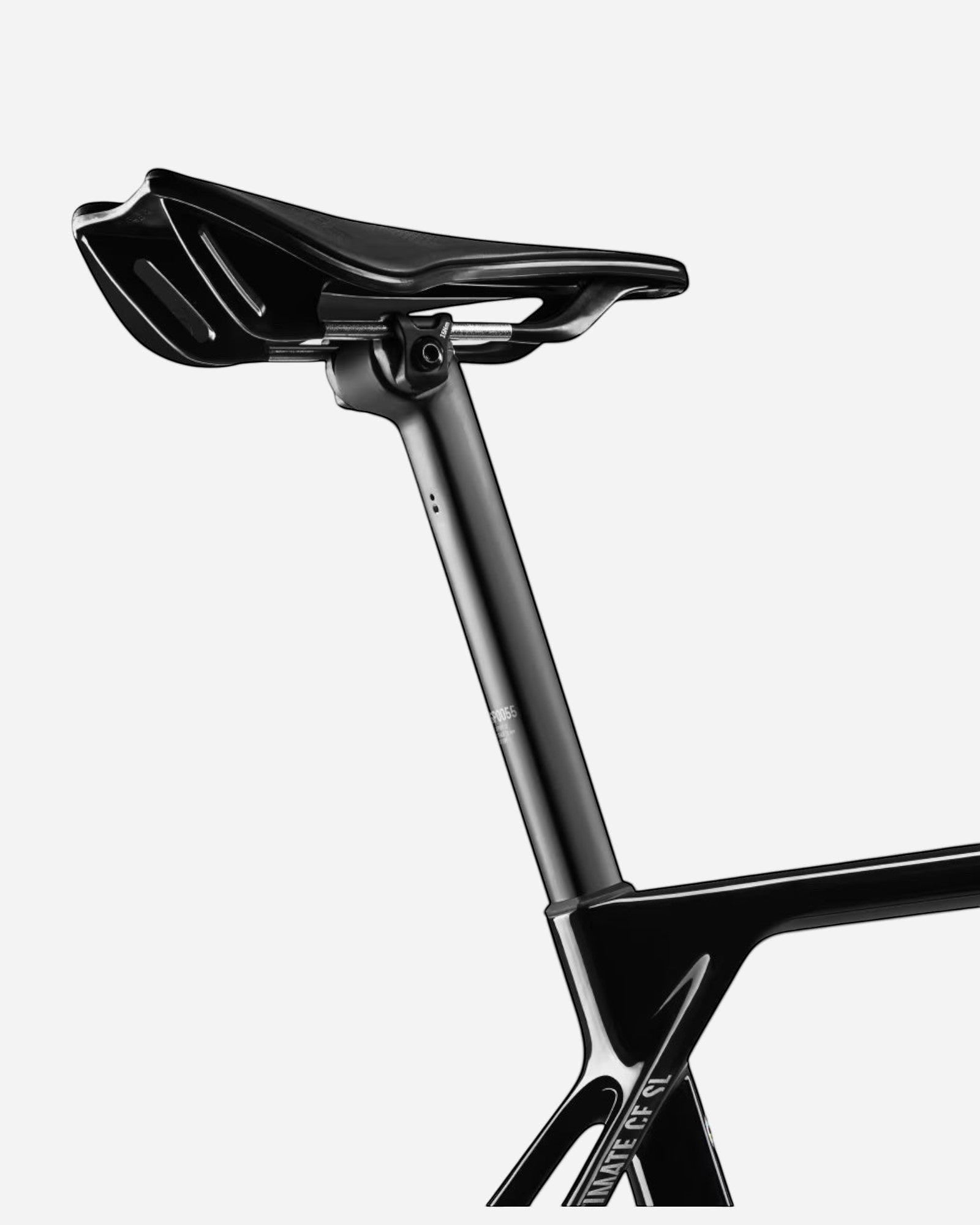 Moloko Cycling Ltd. black carbon fiber road bike seatpost and saddle with aerodynamic design.