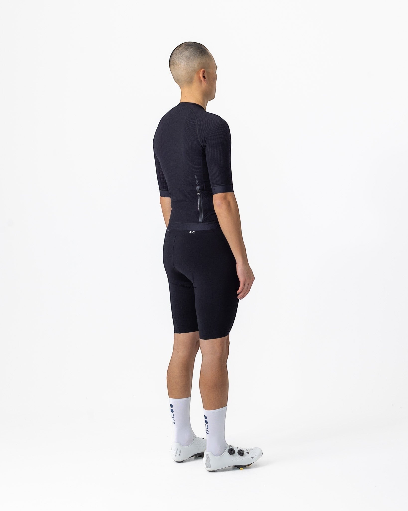 Moloko Cycling Ltd. men's black short sleeve cycling jersey made from French nylon with a cropped fit and raglan sleeves.